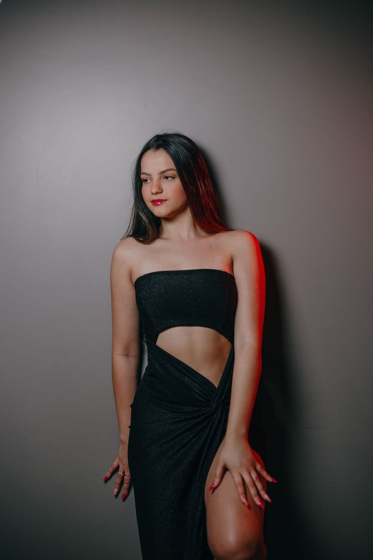 Editorial inspiration: a draped black dress with an asymmetric waist cutout